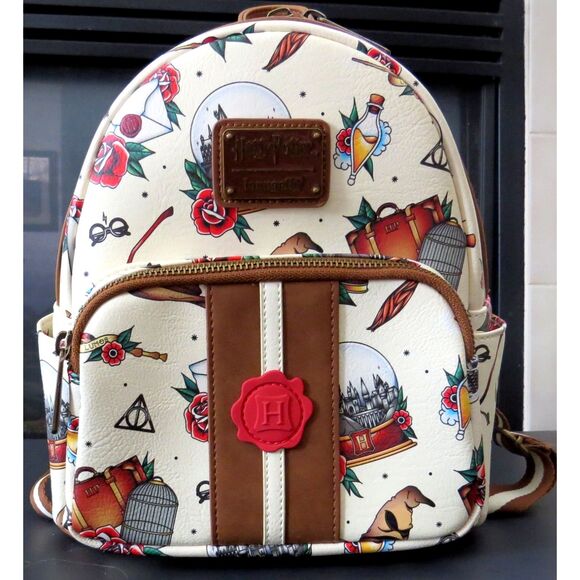 Loungefly Handbags - Loungefly x Harry Potter Tattoo Print Mini backpack/purse  NWOT